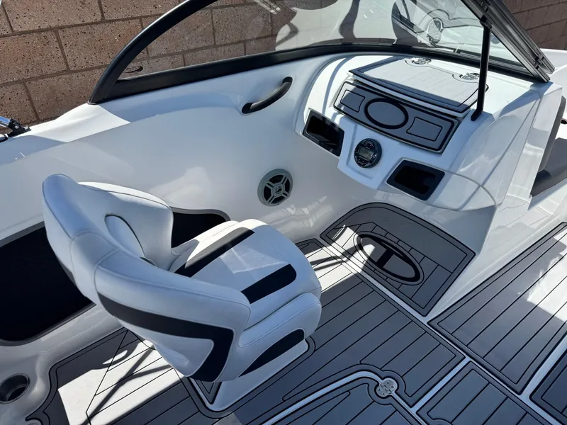 Slide: The Image of 2019 Tracker Tahoe 450 TF boat interior with white seating and sleek dashboard design. - 15