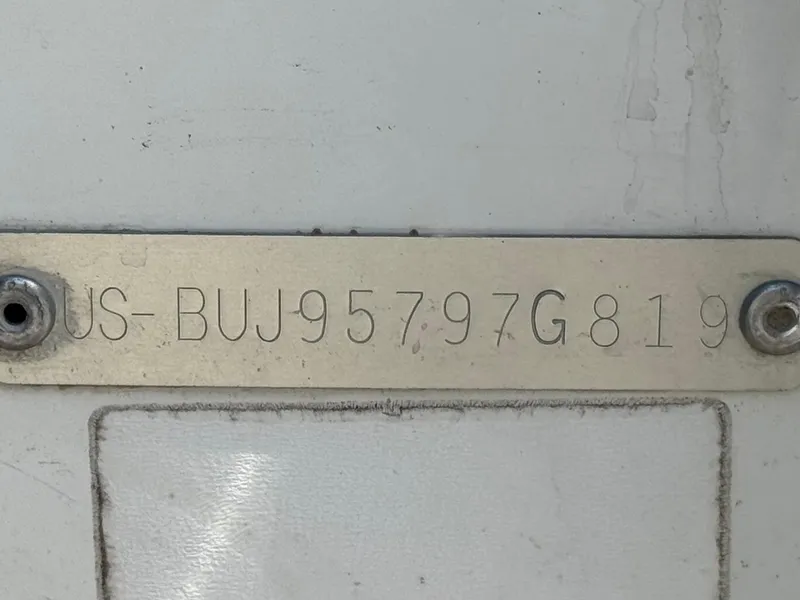 Slide: The Image of Metal identification plate on a 2019 Tracker Tahoe 450 TF boat. - 22