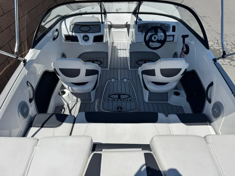 Slide: The Image of 2019 Tracker Tahoe 450 TF boat interior with seating and steering wheel. - 7