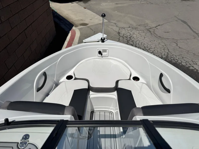 Slide: The Image of 2019 Tracker Tahoe 450 TF boat interior with seating and cup holders. - 9