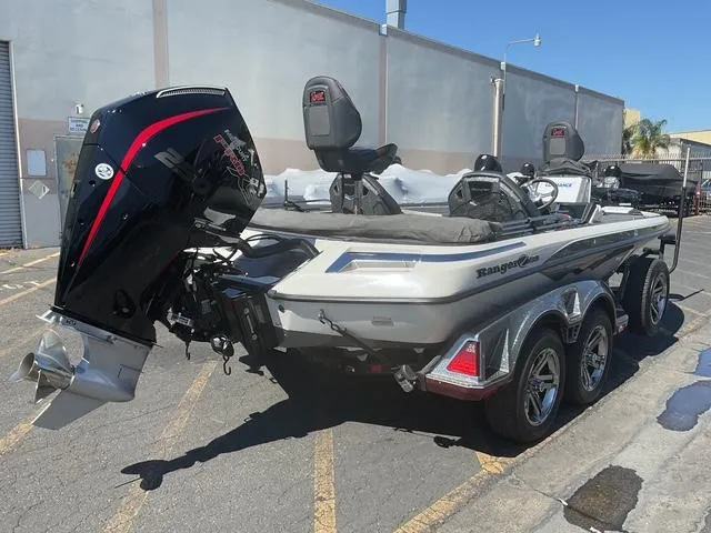 Slide: The Image of 2023 Ranger Z520R Ranger Cup Equipped boat with powerful outboard motor, parked outdoors. - 14