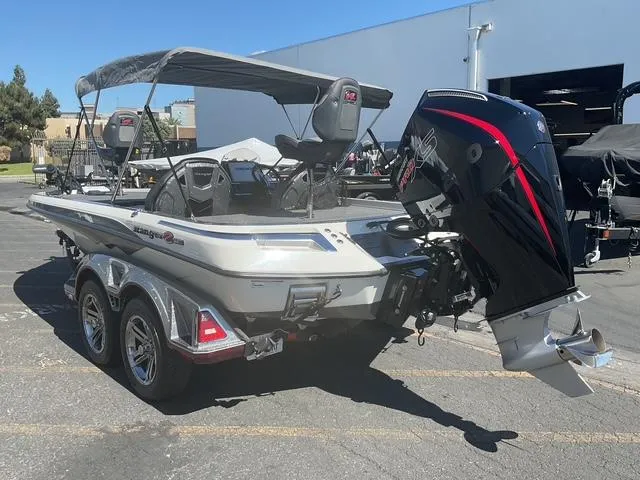 Slide: The Image of 2023 Ranger Z520R Ranger Cup Equipped boat with powerful outboard motor in a parking lot. - 17