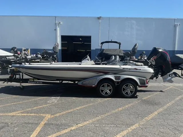 Slide: The Image of 2023 Ranger Z520R Ranger Cup Equipped boat on trailer, parked outdoors. - 2