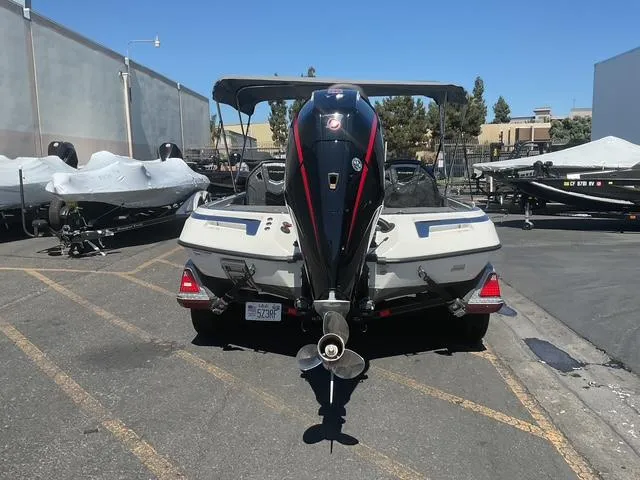 Slide: The Image of 2023 Ranger Z520R boat parked outdoors, rear view, showcasing motor and sleek design. - 21