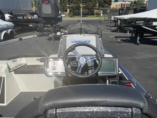 Slide: The Image of 2023 Ranger Z520R boat dashboard with Lowrance electronics and steering wheel. - 7