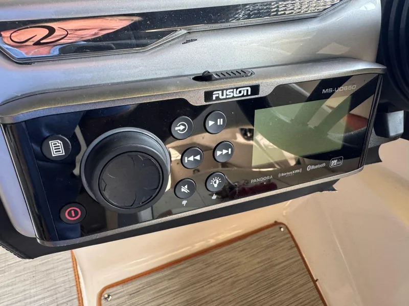 Slide: The Image of Fusion MS-UD650 audio system on 2018 Regal 1900 ESX Bowrider boat dashboard. - 14