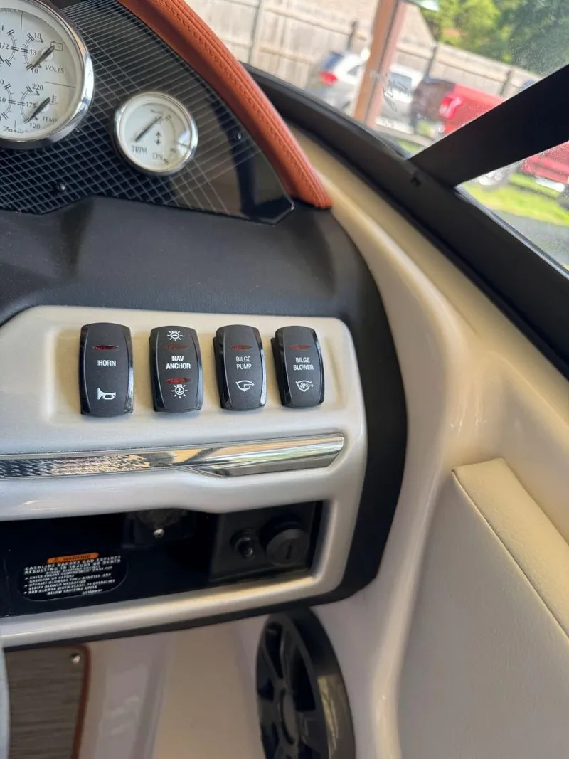 Slide: The Image of Control panel of 2018 Regal 1900 ESX Bowrider with switches and gauges. - 15