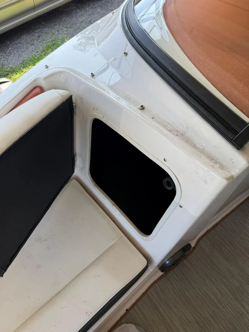 Slide: The Image of 2018 Regal 1900 ESX Bowrider interior storage compartment and seating area. - 20