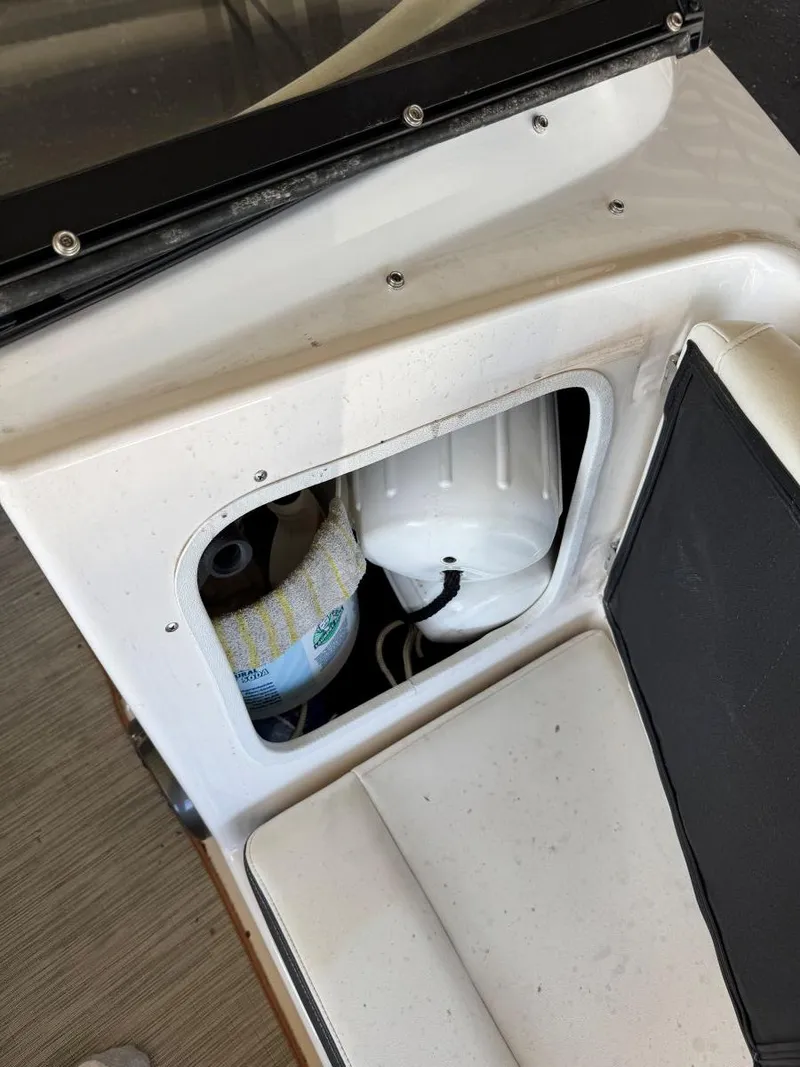 Slide: The Image of 2018 Regal 1900 ESX Bowrider interior storage compartment with equipment. - 21