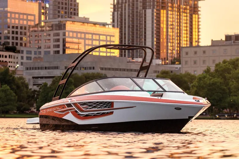 Slide: The Image of Manufacturer Provided Image: 2017 Regal 1900 ESX Bowrider boat on water with city skyline background. - 30