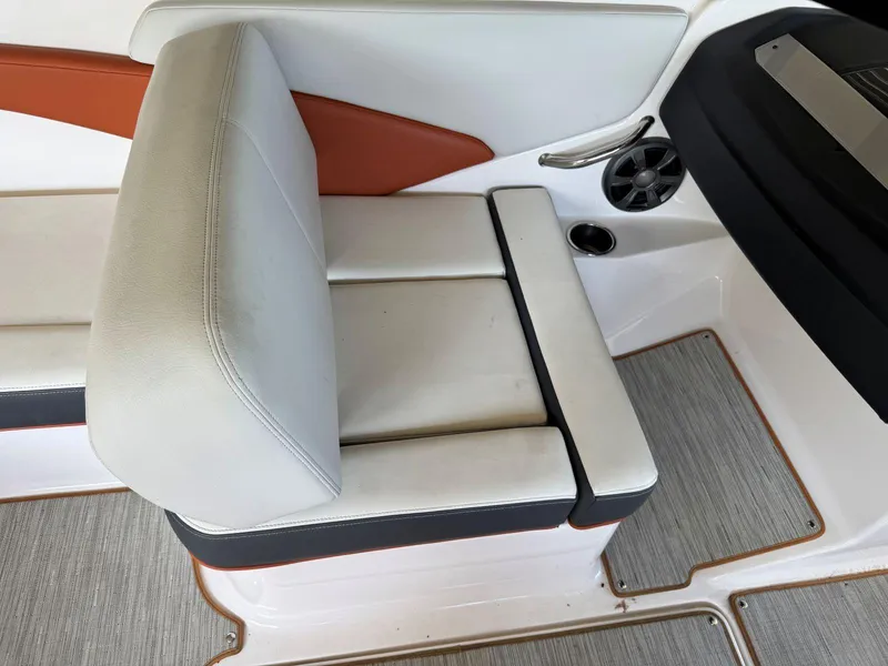 Slide: The Image of 2018 Regal 1900 ESX Bowrider interior seating with white and orange upholstery. - 8