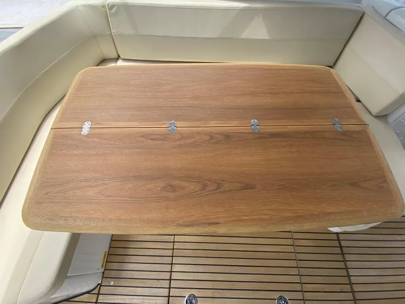 Slide: The Image of Wooden table and seating area on a 2016 Beneteau GT35 yacht. - 33