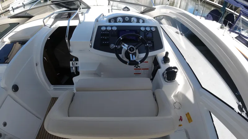 Slide: The Image of 2016 Beneteau GT35 helm station with modern controls and comfortable seating. - 10