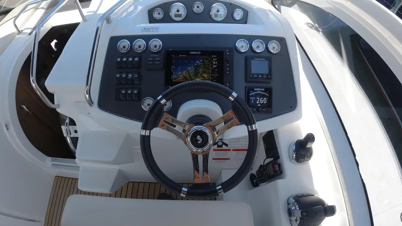 Slide: The Image of 2016 Beneteau GT35 helm with advanced navigation and control systems. - 12