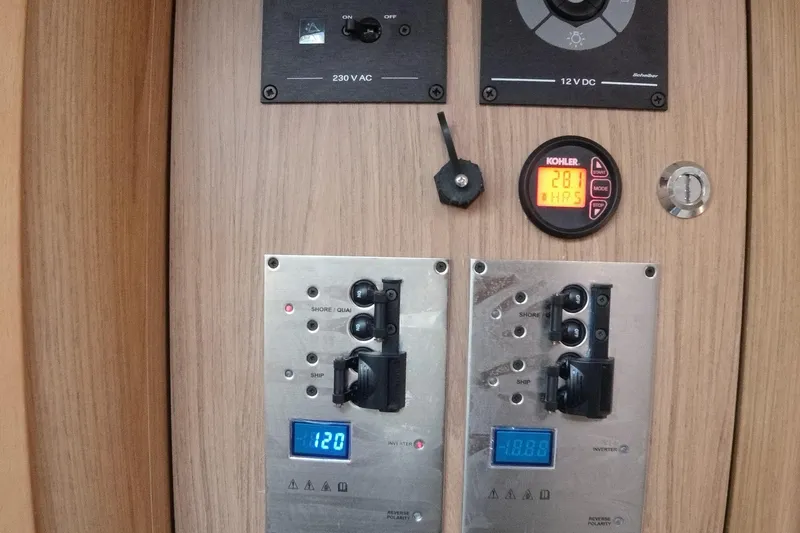 Slide: The Image of Control panel of a 2016 Beneteau GT35 yacht with digital displays and switches. - 19