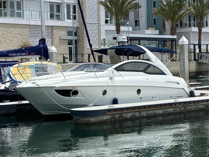 Slide: The Image of 2016 Beneteau GT35 yacht docked at a marina. - 2