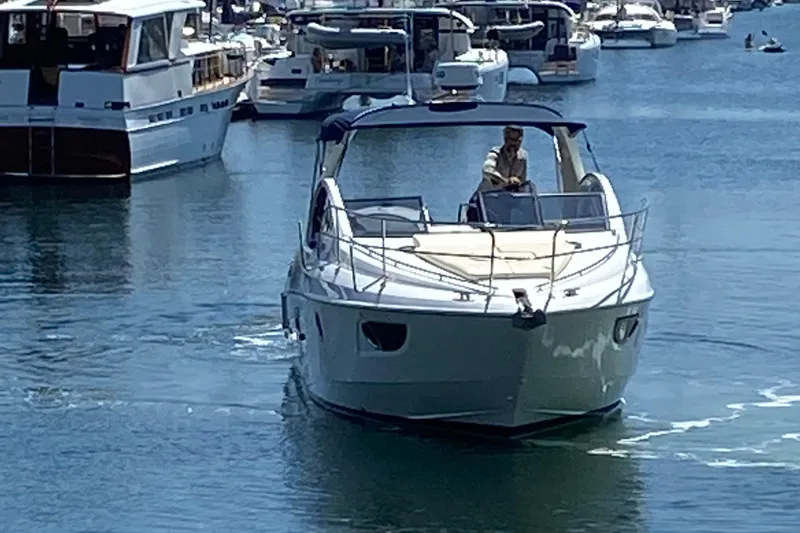 Slide: The Image of 2016 Beneteau GT35 yacht cruising in a busy marina. - 3