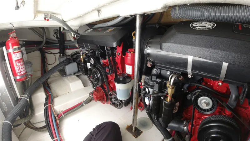 Slide: The Image of Engine room of a 2016 Beneteau GT35 boat with dual engines and fire extinguisher. - 37
