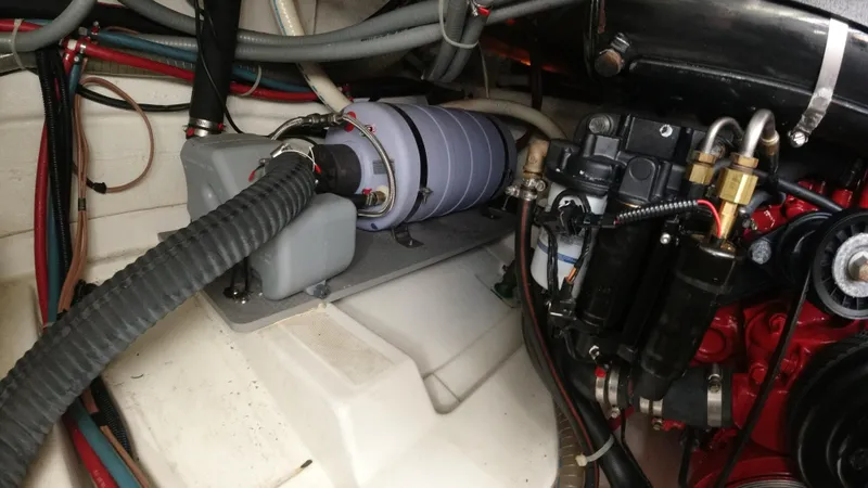 Slide: The Image of Engine compartment of a 2016 Beneteau GT35 boat showing various mechanical components. - 38
