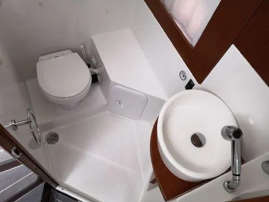 Slide: The Image of 2016 Beneteau GT35 bathroom with toilet, sink, and modern fixtures. - 6