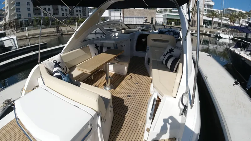 Slide: The Image of 2016 Beneteau GT35 yacht with spacious deck and seating area in marina. - 7