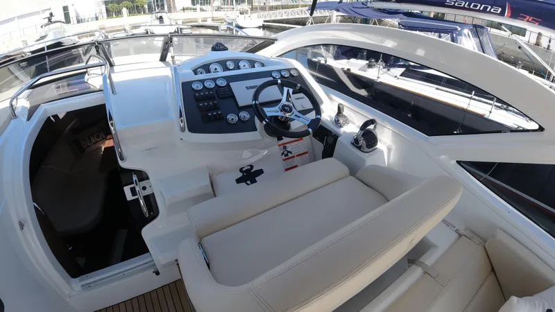 Slide: The Image of 2016 Beneteau GT35 cockpit with steering wheel and control panel. - 8