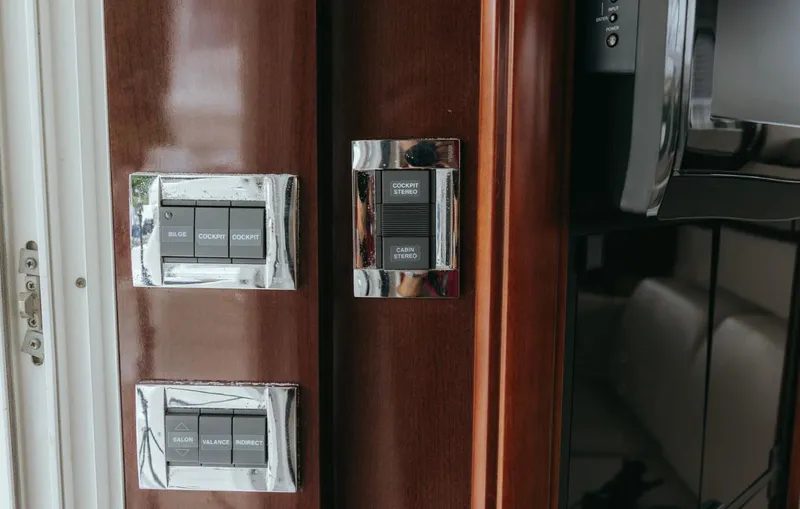 Slide: The Image of Control panel on 2010 Sea Ray 390 Sedan Bridge yacht interior. - 15