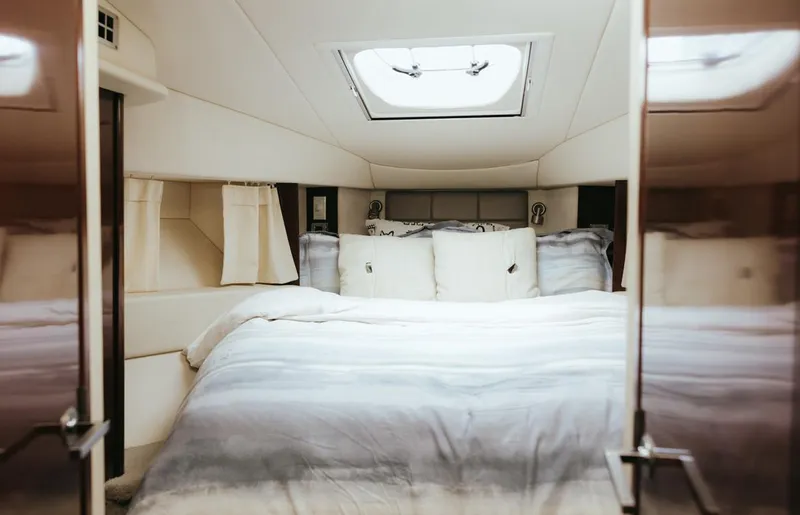 Slide: The Image of Luxurious bedroom interior of 2010 Sea Ray 390 Sedan Bridge yacht. - 17