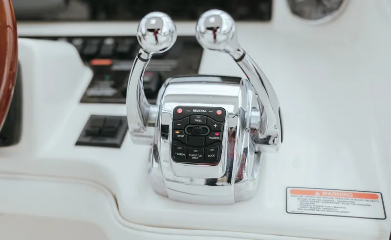 Slide: The Image of Close-up of 2010 Sea Ray 390 Sedan Bridge throttle controls. - 22