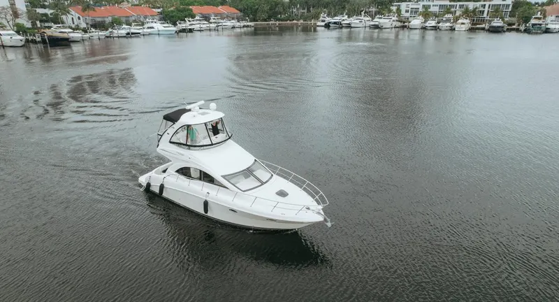 Slide: The Image of 2010 Sea Ray 390 Sedan Bridge yacht cruising in a marina. - 7