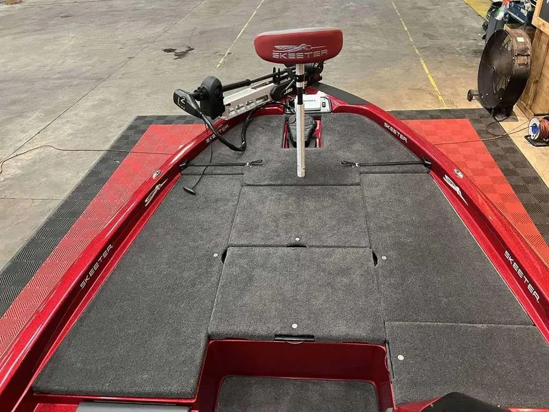 Slide: The Image of 2015 Skeeter ZX 200 boat interior with red accents and carpeted deck. - 5