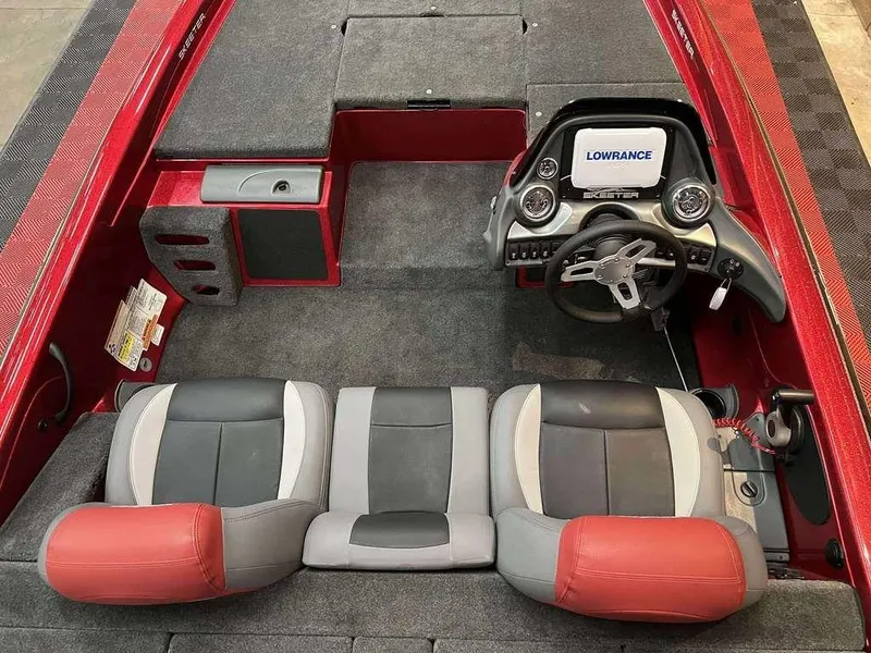 Slide: The Image of 2015 Skeeter ZX 200 boat interior with steering wheel, seats, and Lowrance display. - 6