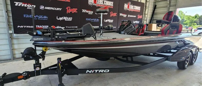 Slide: The Image of 2026 Nitro Z21 XL Pro boat on display in a showroom setting. - 3