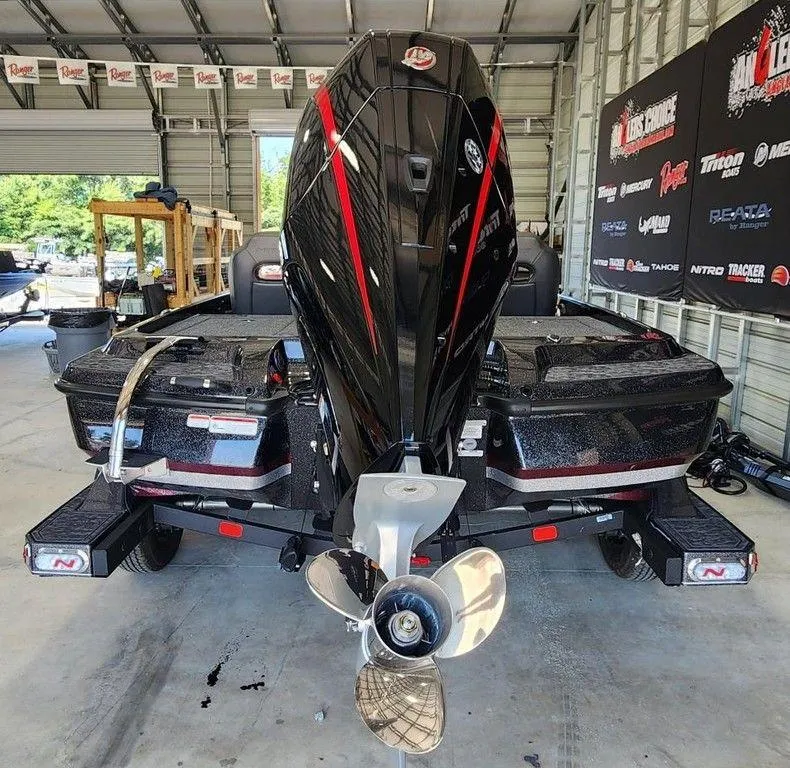 Slide: The Image of 2026 Nitro Z21 XL Pro boat in a garage, showcasing its powerful engine and sleek design. - 5