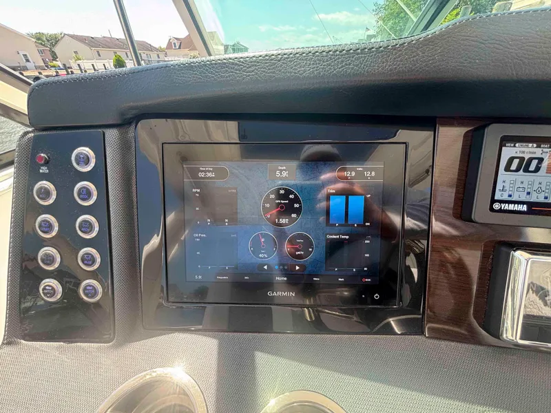 Slide: The Image of Dashboard of 2020 Chaparral 300 OSX boat with Garmin display and controls. - 13