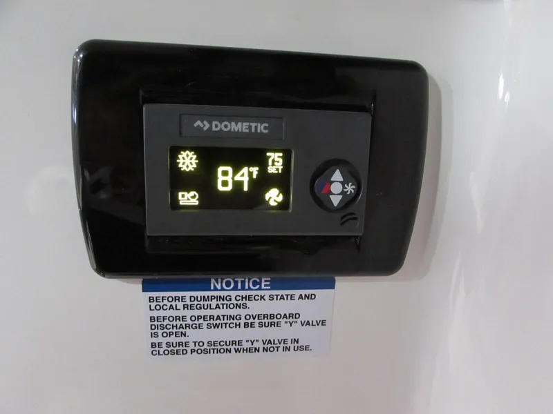 Slide: The Image of Thermostat display on 2020 Chaparral 300 OSX, showing 84°F with operational instructions. - 23