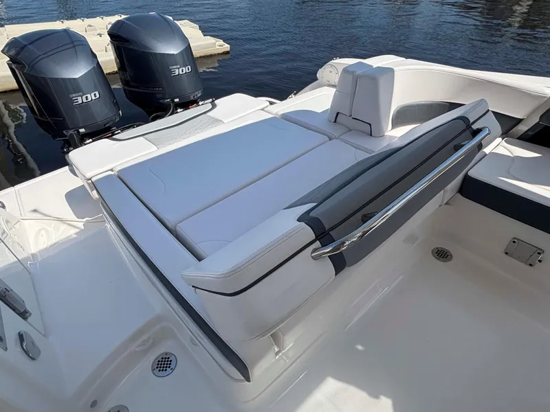 Slide: The Image of 2020 Chaparral 300 OSX boat with dual Yamaha 300 engines, featuring a spacious sun deck. - 27