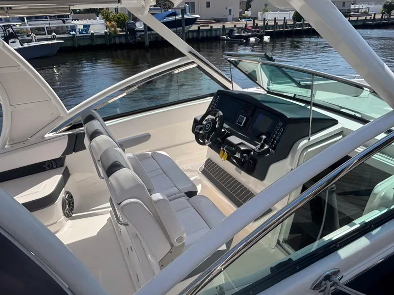 Slide: The Image of 2020 Chaparral 300 OSX boat interior with modern helm and seating. - 31