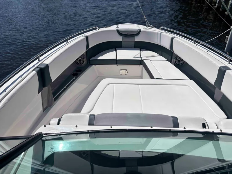 Slide: The Image of 2020 Chaparral 300 OSX boat interior with spacious seating and sleek design. - 7