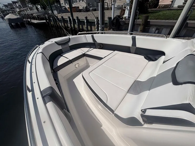 Slide: The Image of 2020 Chaparral 300 OSX boat interior with spacious seating and sleek design. - 8