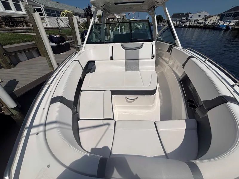 Slide: The Image of 2020 Chaparral 300 OSX boat interior with spacious seating and modern design. - 9