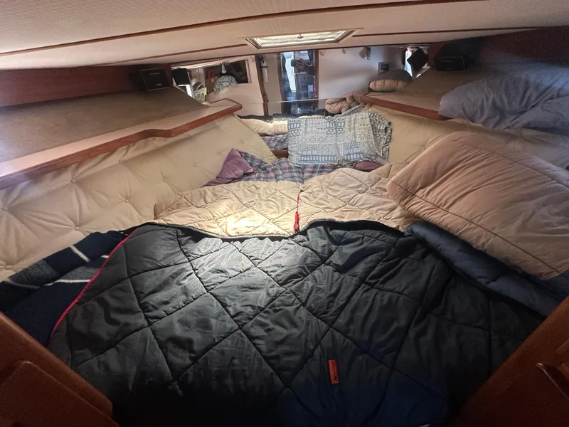 Slide: The Image of Cozy cabin interior of 1989 Tollycraft 30 Sedan with bedding and pillows. - 15
