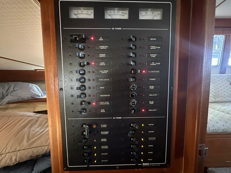 Slide: The Image of Electrical control panel inside a 1989 Tollycraft 30 Sedan boat cabin. - 16
