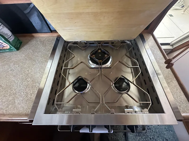 Slide: The Image of Stainless steel stove in 1989 Tollycraft 30 Sedan boat kitchen. - 19