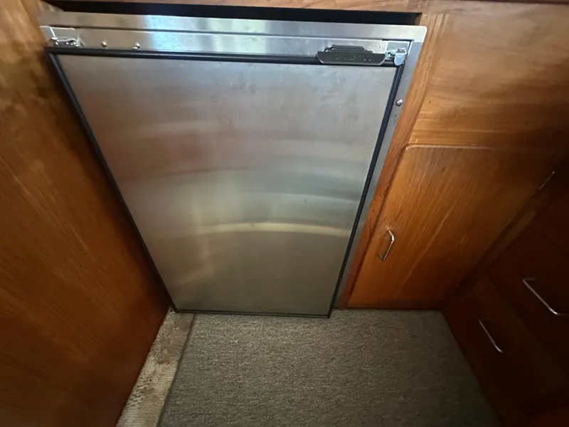 Slide: The Image of Stainless steel refrigerator in 1989 Tollycraft 30 Sedan boat interior. - 21