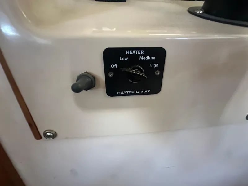 Slide: The Image of Heater control panel on 1989 Tollycraft 30 Sedan boat, showing settings for low, medium, and high. - 23
