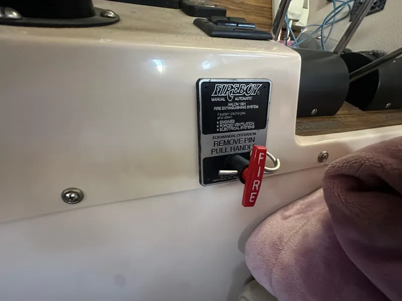 Slide: The Image of Fire extinguisher system control panel on 1989 Tollycraft 30 Sedan boat. - 24