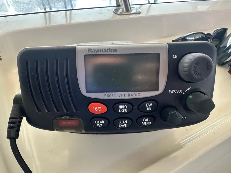 Slide: The Image of Raymarine Ray54 VHF radio on 1989 Tollycraft 30 Sedan boat dashboard. - 26