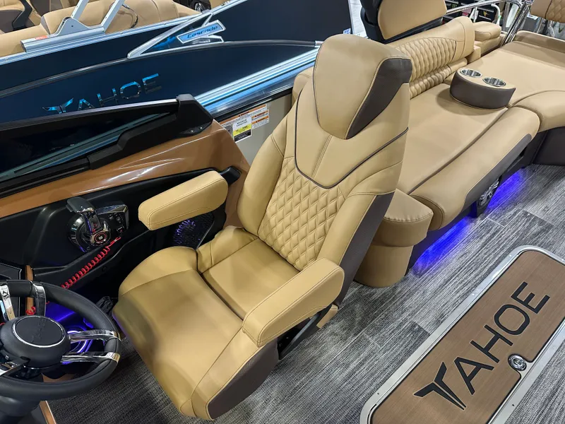 Slide: The Image of Luxurious interior of 2025 Tahoe Grand Tahoe 2585 Tritoon with plush seating and modern controls. - 14
