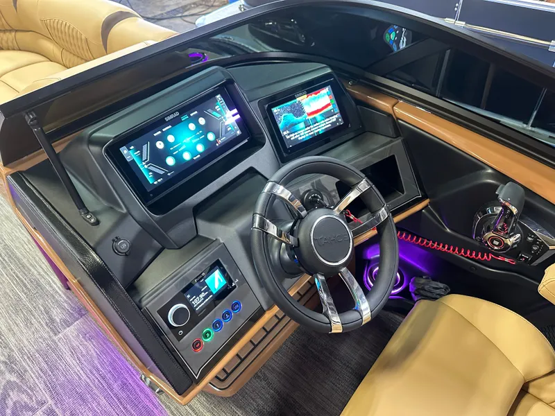 Slide: The Image of 2025 Tahoe Grand Tahoe 2585 Tritoon dashboard with modern controls and steering wheel. - 15